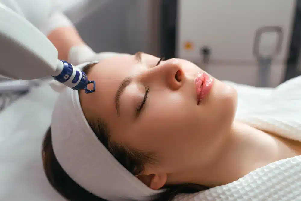 Woman getting laser skin treatment at a medspa