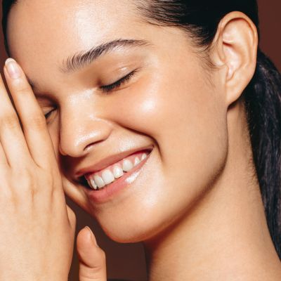 woman with glowing skin after mesoneedling milwaukee evolvmd med spa